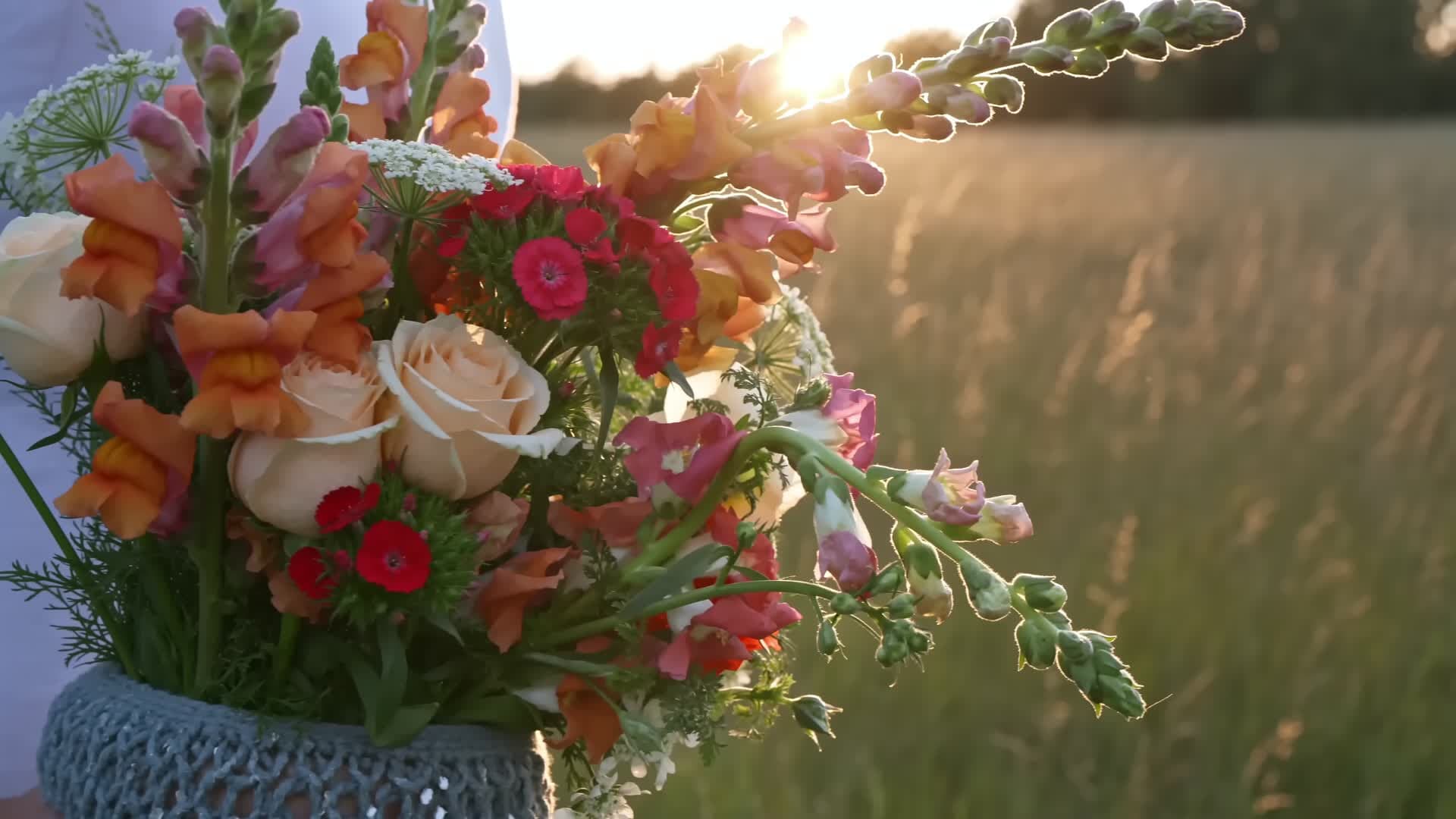 A bouquet of wildflowers in a meadow at golden hour